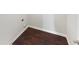 This is a small laundry room with wooden floors at 4428 Belcamp Rd, Fairburn, GA 30213