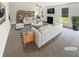 Bright living room showcasing stylish sofas, a black and white rug, a fireplace and built-in shelving at 4428 Belcamp Rd, Fairburn, GA 30213