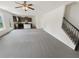 Open floor plan with stairs, seamlessly connecting the living room to the modern kitchen with an island at 4428 Belcamp Rd, Fairburn, GA 30213