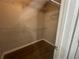 Walk-in closet offering built-in wire shelving and wood-look floors at 3835 Portico Run Dr, Buford, GA 30519