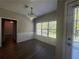 Bright dining area with natural light, wood-look flooring, and decorative chair rail at 3835 Portico Run Dr, Buford, GA 30519
