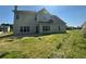 Exterior back view of home, large yard and windows at 3835 Portico Run Dr, Buford, GA 30519