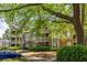 Well-maintained apartment building with balconies, complemented by mature trees and landscaping at 405 Mcgill Park Ne Ave, Atlanta, GA 30312