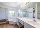 Spacious bathroom featuring a soaking tub, separate shower, and dual vanities at 405 Mcgill Park Ne Ave, Atlanta, GA 30312