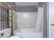 Close-up of bathroom's shower-tub combo area showcasing tiled enclosure at 405 Mcgill Park Ne Ave, Atlanta, GA 30312