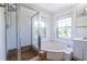 Bathroom features a large soaking tub, and a separate glass enclosed shower at 405 Mcgill Park Ne Ave, Atlanta, GA 30312