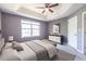 Comfortable bedroom featuring trey ceilings, soft carpet, and a ceiling fan at 405 Mcgill Park Ne Ave, Atlanta, GA 30312