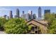 Attractive building featuring convenient parking and a backdrop of the impressive cityscape skyline at 405 Mcgill Park Ne Ave, Atlanta, GA 30312