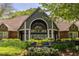 Beautifully landscaped clubhouse featuring a grand entrance with elegant architectural details and vibrant floral arrangements at 405 Mcgill Park Ne Ave, Atlanta, GA 30312