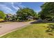 Inviting community entrance with well-manicured lawns, a gatehouse, and an elegant community sign at 405 Mcgill Park Ne Ave, Atlanta, GA 30312