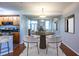 Dining room with modern lighting, decor, and views into the kitchen at 405 Mcgill Park Ne Ave, Atlanta, GA 30312