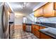 Updated kitchen featuring wood cabinets, granite countertops, stainless steel appliances, open to stairs at 405 Mcgill Park Ne Ave, Atlanta, GA 30312