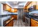 Kitchen featuring stainless steel appliances, granite countertops, and tile flooring at 405 Mcgill Park Ne Ave, Atlanta, GA 30312
