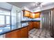 Bright kitchen featuring wood cabinets, granite countertops, stainless steel appliances and stylish flooring at 405 Mcgill Park Ne Ave, Atlanta, GA 30312