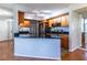Charming kitchen featuring wood cabinets, granite countertops, and stainless steel appliances at 405 Mcgill Park Ne Ave, Atlanta, GA 30312