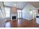 Living room with fireplace, hardwood floors, and large windows at 405 Mcgill Park Ne Ave, Atlanta, GA 30312