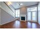 Living room featuring hardwood floors, fireplace, and natural light at 405 Mcgill Park Ne Ave, Atlanta, GA 30312