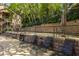 Upscale poolside featuring lounging chairs, and tall shade trees at 405 Mcgill Park Ne Ave, Atlanta, GA 30312