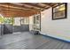 Cozy covered deck with wood floors and open ceiling, perfect for outdoor relaxation and entertaining at 4264 Windward Ln, Norcross, GA 30093