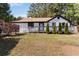 Charming single-story home with a well-maintained lawn, cozy front porch, and fresh exterior paint at 4264 Windward Ln, Norcross, GA 30093