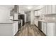 Stylish kitchen with white cabinets, granite countertops, and stainless-steel appliances, perfect for cooking at 4264 Windward Ln, Norcross, GA 30093