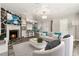 Bright open-concept living room with modern fireplace, chandelier lighting, and updated flooring at 4264 Windward Ln, Norcross, GA 30093