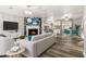 Spacious open-plan living room showcasing a fireplace, modern furniture, and seamless flow to the kitchen at 4264 Windward Ln, Norcross, GA 30093
