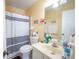 Bathroom featuring a black-striped shower curtain, toilet, and vanity with mirror at 5607 Stonington Trace Pkwy, Stone Mountain, GA 30087