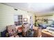 Well-lit room with yellow walls, containing shelves and boxes for storage purposes at 5607 Stonington Trace Pkwy, Stone Mountain, GA 30087