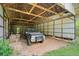 Barn interior, with vehicle, offering lots of dry storage at 751 Upper Burris Rd, Canton, GA 30114