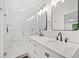 Modern bathroom featuring marble tile shower, double sinks, and stylish fixtures at 751 Upper Burris Rd, Canton, GA 30114