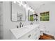 Clean, modern bathroom featuring double sinks, large mirrors, and a spacious vanity at 751 Upper Burris Rd, Canton, GA 30114