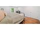 Bright bedroom featuring hardwood floors and a large window for lots of natural light at 751 Upper Burris Rd, Canton, GA 30114