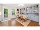 Charming dining room with built-in cabinets, hardwood floors, and natural light at 751 Upper Burris Rd, Canton, GA 30114