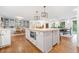 Open kitchen island, breakfast bar, and hardwood floors provide an eat-in area at 751 Upper Burris Rd, Canton, GA 30114