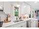 Close up of a modern kitchen, featuring quartz countertops and sleek appliances at 751 Upper Burris Rd, Canton, GA 30114