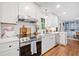 Stylish kitchen with stainless steel appliances and modern fixtures offers plenty of countertop space at 751 Upper Burris Rd, Canton, GA 30114