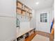 Well-organized mudroom features a bench, storage baskets, hooks, and a door with window, enhancing functionality and style at 751 Upper Burris Rd, Canton, GA 30114