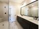 Bathroom boasts double sinks, shower with glass door, and black fixtures at 1432 Fairmont Ave, Atlanta, GA 30318