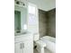 Bathroom featuring tub, shower, toilet, sink, medicine cabinet, and gray wall tiles at 1432 Fairmont Ave, Atlanta, GA 30318