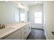 Bright bathroom with double sink vanity, sleek gray tile floor, and modern fixtures at 1432 Fairmont Ave, Atlanta, GA 30318