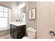 Well-lit bathroom featuring modern vanity, stylish mirror, and tiled shower at 1432 Fairmont Ave, Atlanta, GA 30318
