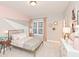 Stylish bedroom featuring unique painted wall, gold-toned accents, and ample natural light at 1432 Fairmont Ave, Atlanta, GA 30318