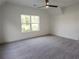 Spacious bedroom featuring a large window and plush gray carpeting at 1432 Fairmont Ave, Atlanta, GA 30318
