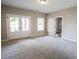 Large bedroom with double doors to a balcony and neutral colored carpet at 1432 Fairmont Ave, Atlanta, GA 30318