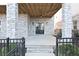 Inviting covered front porch features stone columns and double doors for stylish curb appeal at 1432 Fairmont Ave, Atlanta, GA 30318
