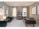Comfortable home office with brick accent wall, modern desk, and seating area near natural light at 1432 Fairmont Ave, Atlanta, GA 30318