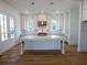 Island kitchen featuring stainless steel appliances, a center island, quartz counters, and hardwood floors at 1432 Fairmont Ave, Atlanta, GA 30318