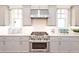 Modern kitchen with stainless steel KitchenAid appliances, white subway tile backsplash and bright countertops at 1432 Fairmont Ave, Atlanta, GA 30318