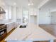 Bright kitchen boasts a large island with white countertop and stainless steel appliances at 1432 Fairmont Ave, Atlanta, GA 30318